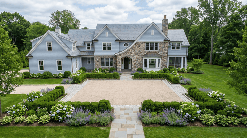 Stately house with a well-manicured garden and pathway